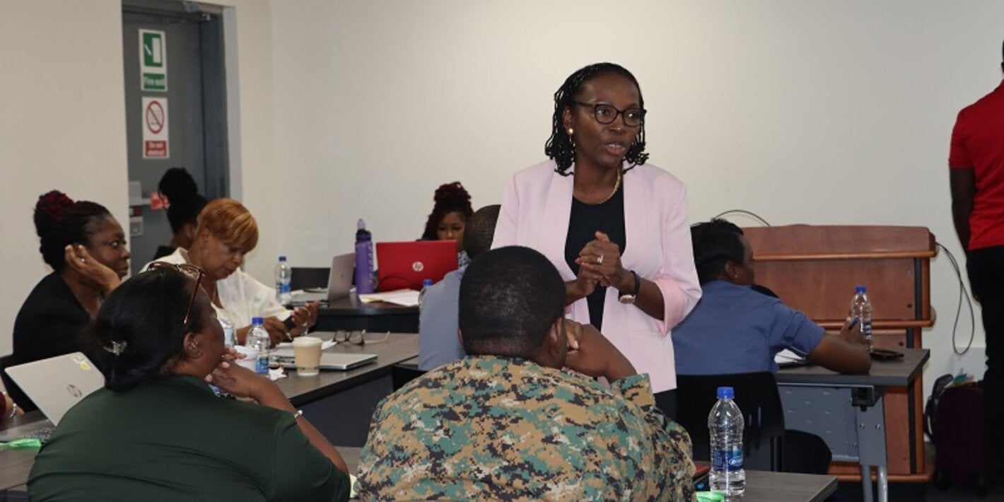 Dr. Claudina Cayetano PAHO's Mental Health Regional Advisor speaking with participants.