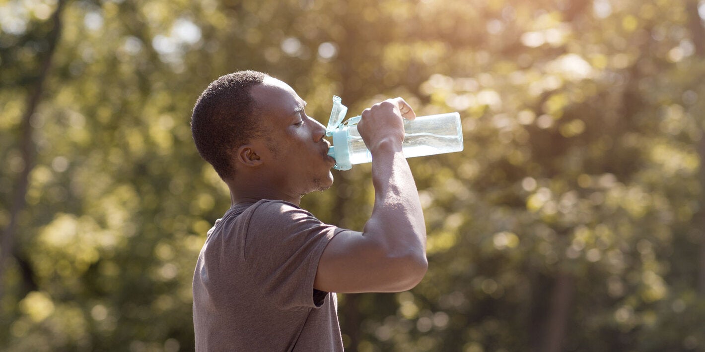 Young man drinking water