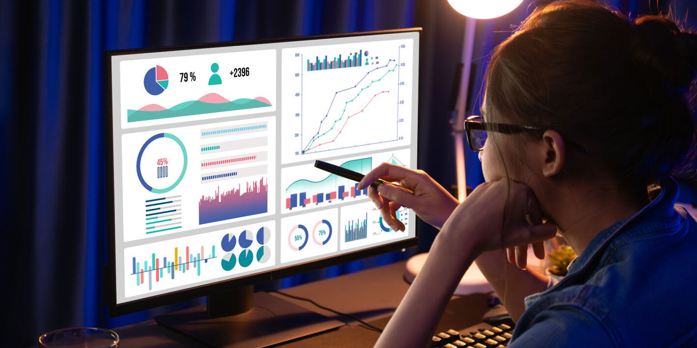 Woman performing data analysis on a computer