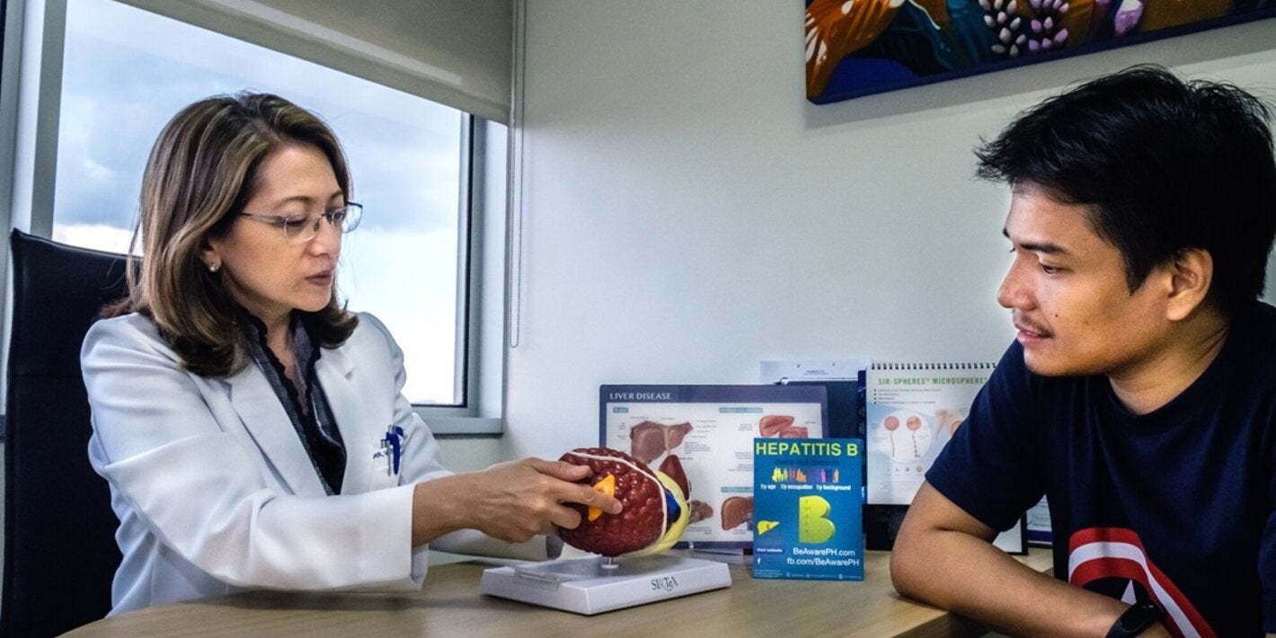 Patient and doctor discuss  liver diseases
