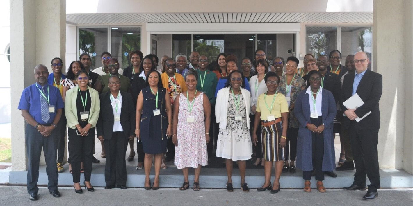 Photo of the group of participants on the workshop on QualityRights, shown standing in three rows at the door of a building