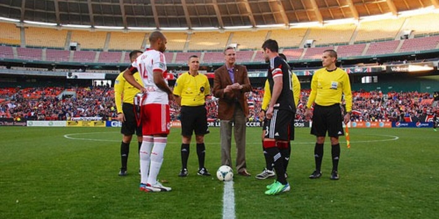 andrus tossing coin at soccer game