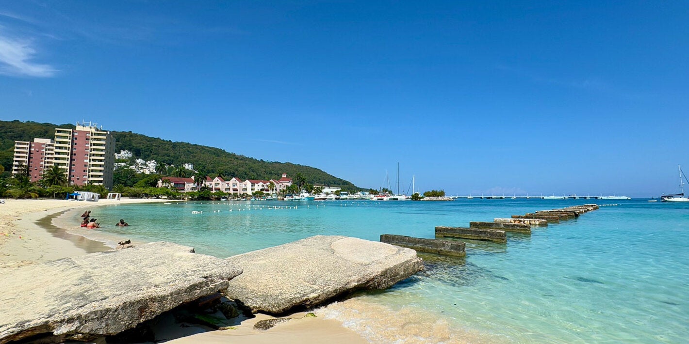 Beautiful blue ocean and white sand Jamaican beach.