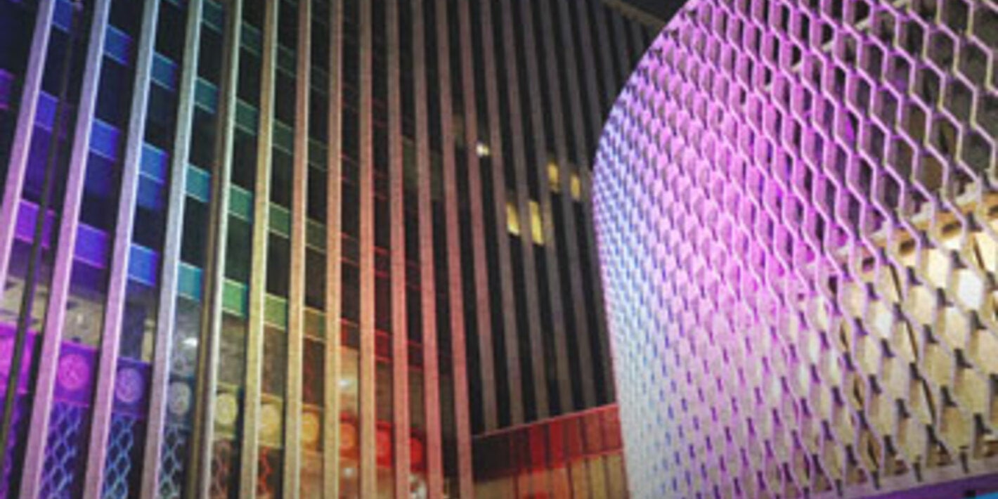Cover with PAHO HQ building with rainbow lights