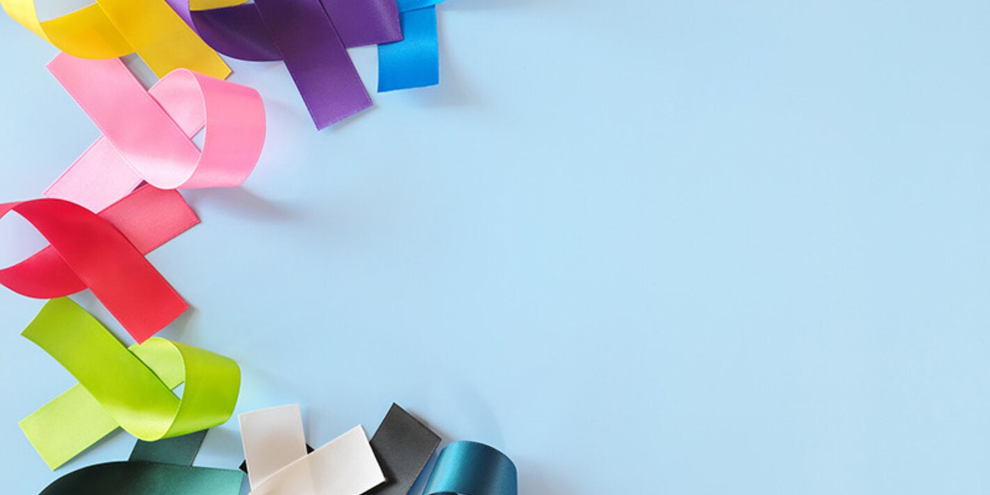 colorful cancer awareness ribbons on blue background