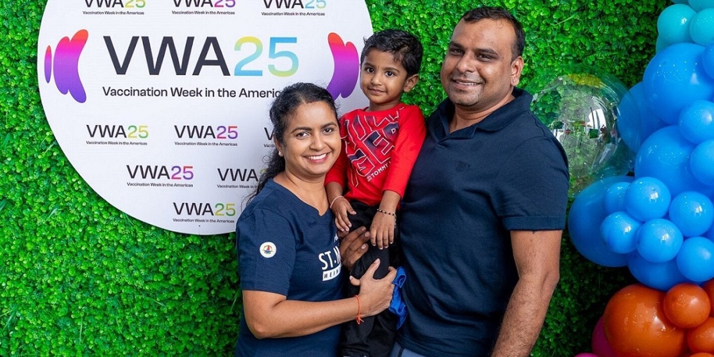 A happy family at the Vaccination and Health Fair for VWA25