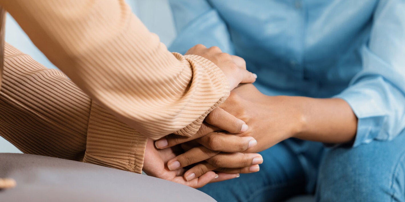 Holding hands as a gesture of support