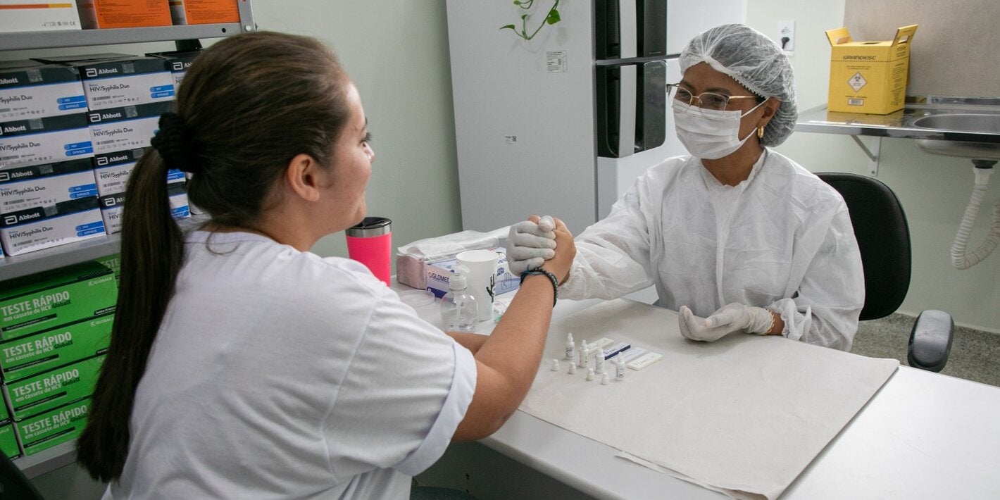 nurse and patient handshake