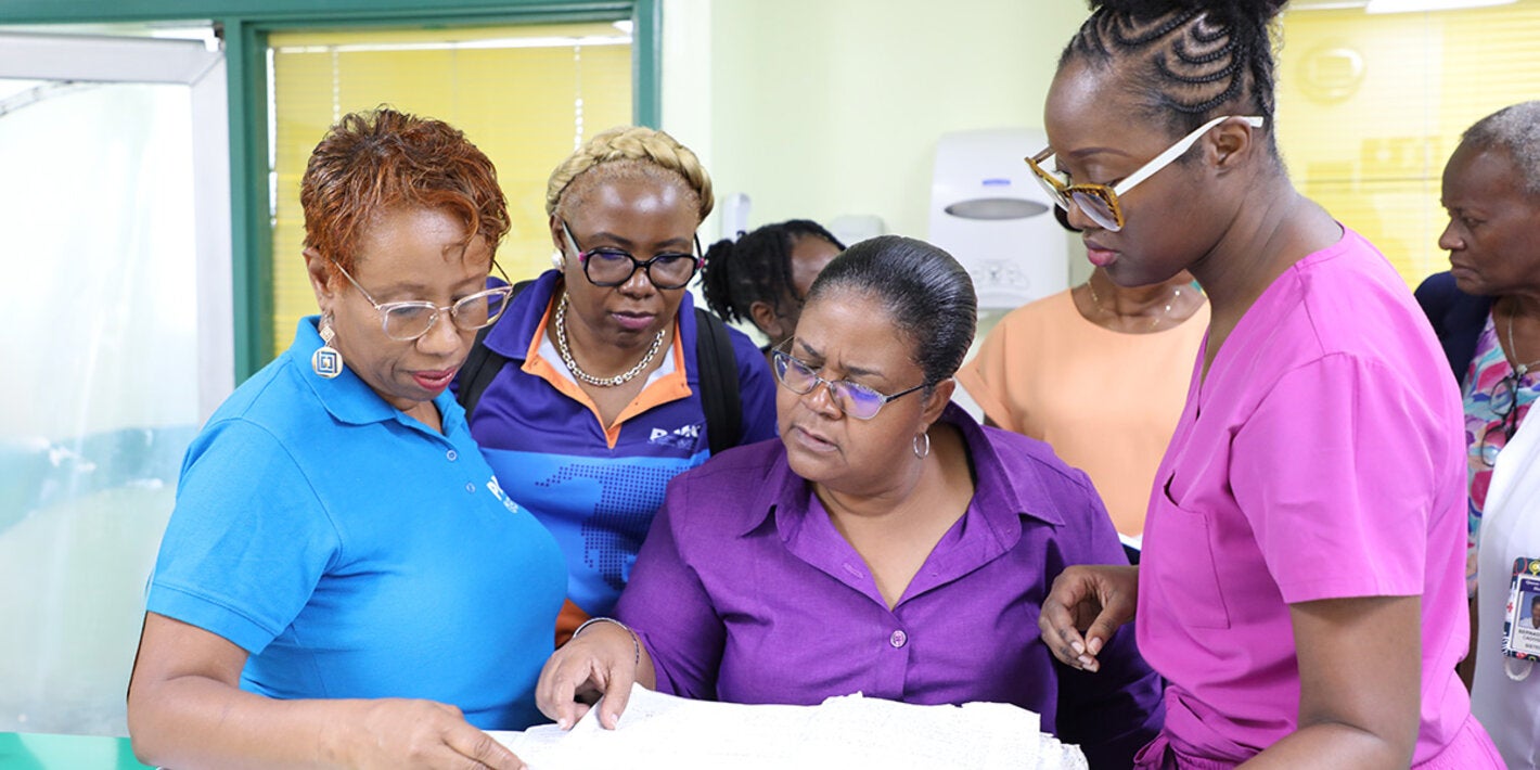 People review log book at a hospital