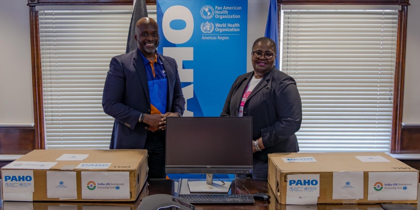 Dr. Anton Best, HSS Advisor (PAHO/WHO) presents the donations to Dr. Keva Thompson, Deputy Managing Director of the Public Hospital Authority. 