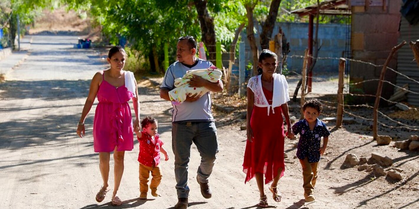 family walking down a rural street