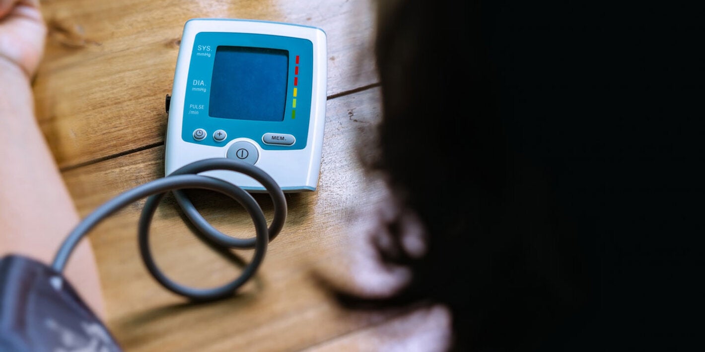 Woman checking her blood pressure