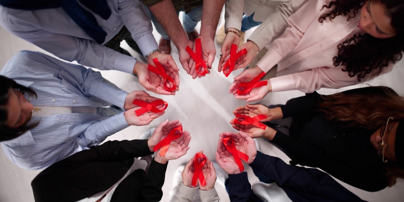 in a circle holding ribbons