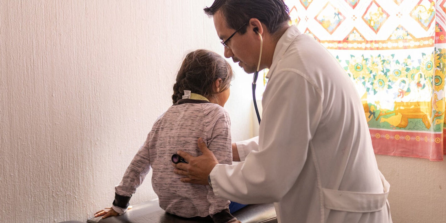 Girl being examined by doctor