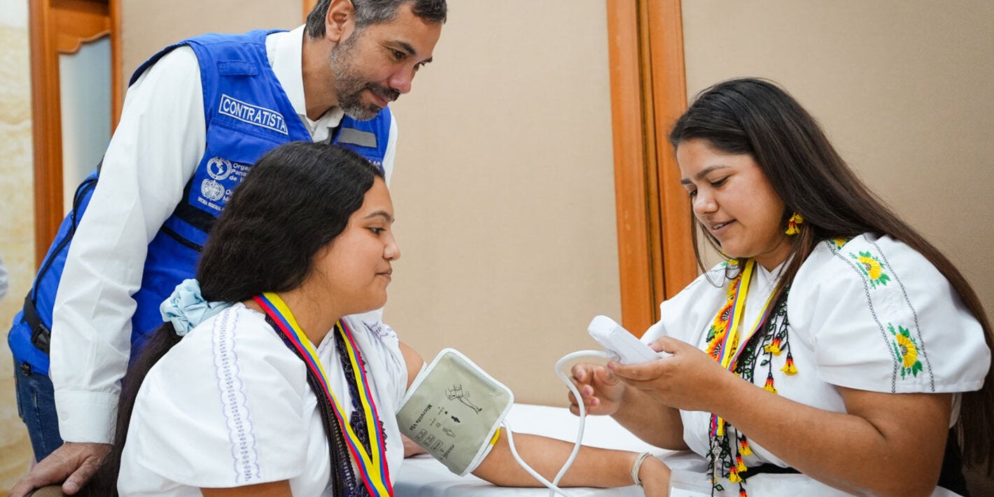 Woman has her blood pressure checked