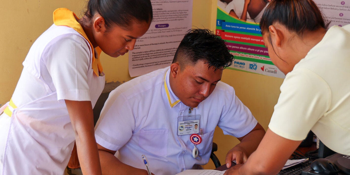 Nurses gather in hospital setting