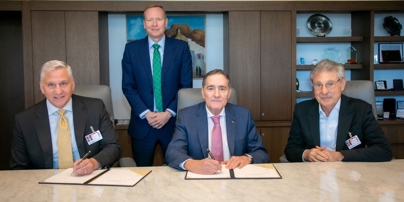PAHO Director Dr. Jarbas Barbosa and David Ross, Executive Vice President and General Manager, CSL Seqirus signing the agreement.