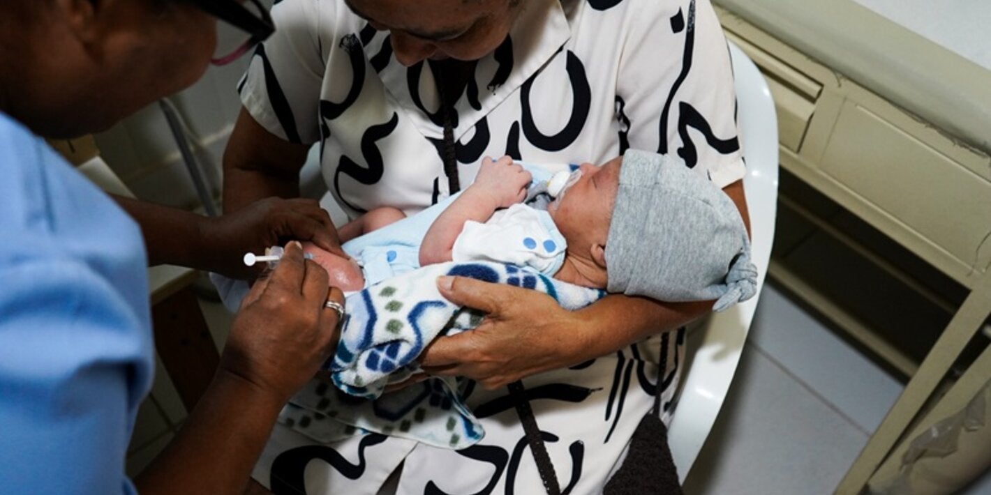 women holding baby