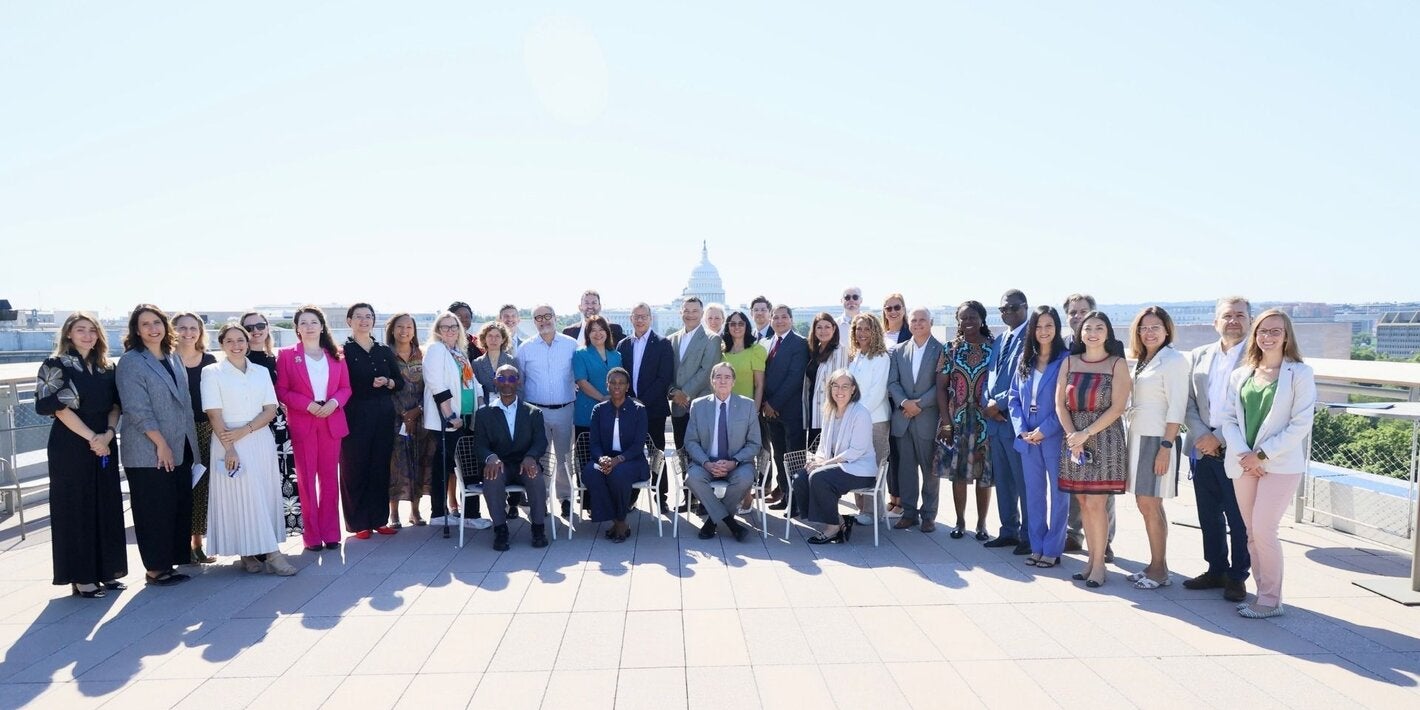 attendees from the meeting standing at a terrace