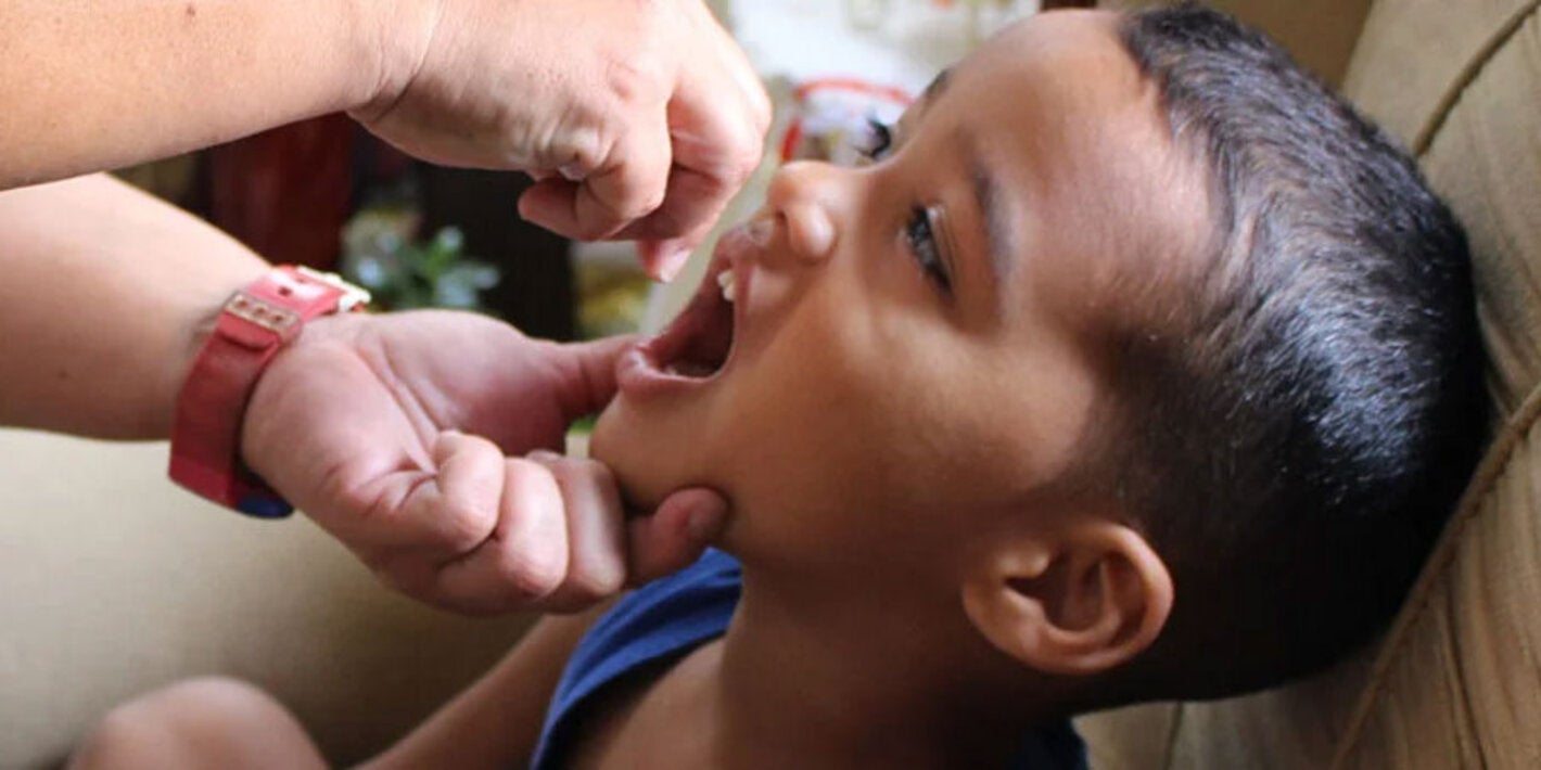 Boy receives polio vaccine