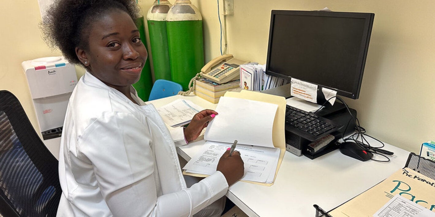 Doctor smiling in her desk