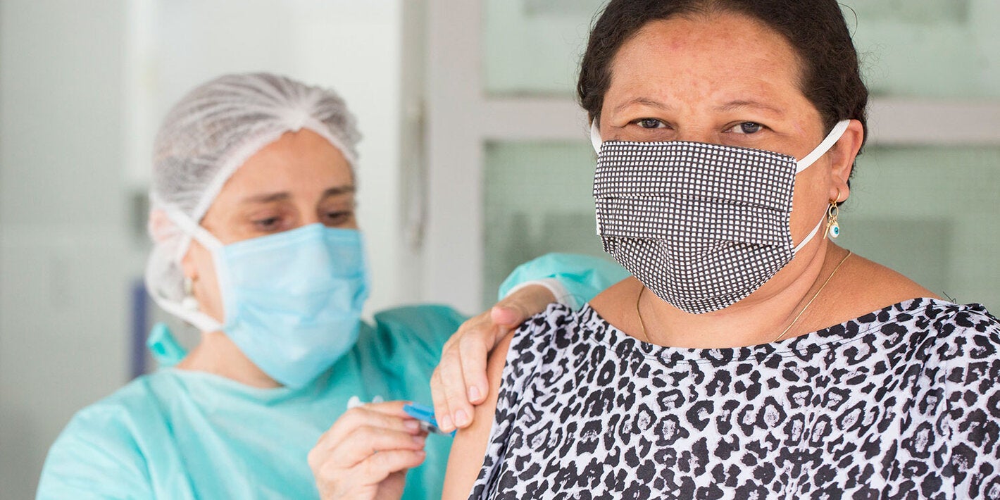 Health care worker administering a vaccine