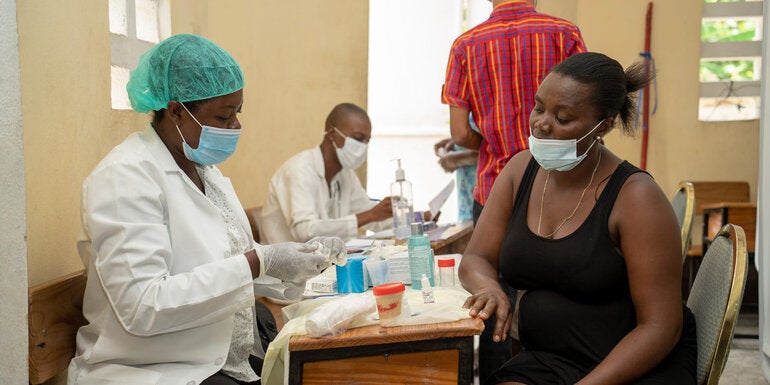 children being vaccinated on black and white film