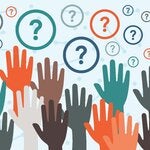 Raised hands of multiple colors