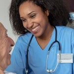 Nurse caring for elderly patient