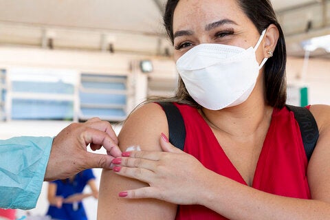 Woman getting vaccinated against COVID-19 