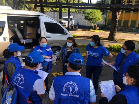 Training in the field. Group speaks outdoors