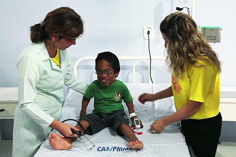 Child with congenital defects is seen by doctor