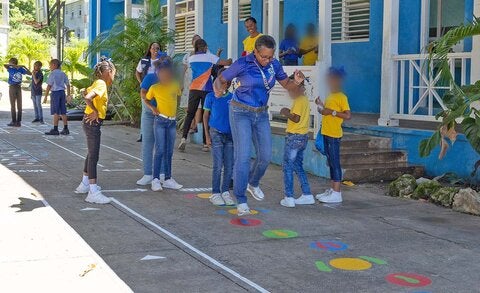 Children and adults playing