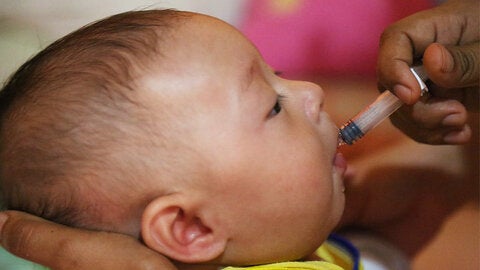 Infant receiving oral vaccine 