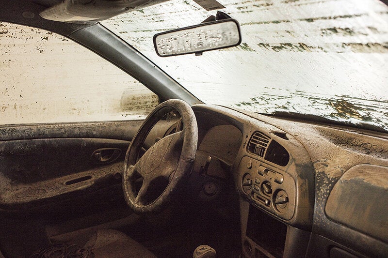Flooded car sits under the sun