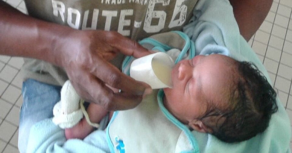 Newborn being fed