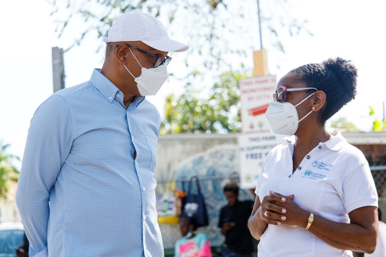 Dr Michael Darville, Min. of Health and Wellness of The Bahamas and Dr. Eldonna Boisson, PAHO/WHO Country Representative discussing the impact of the vaccine pop-up.