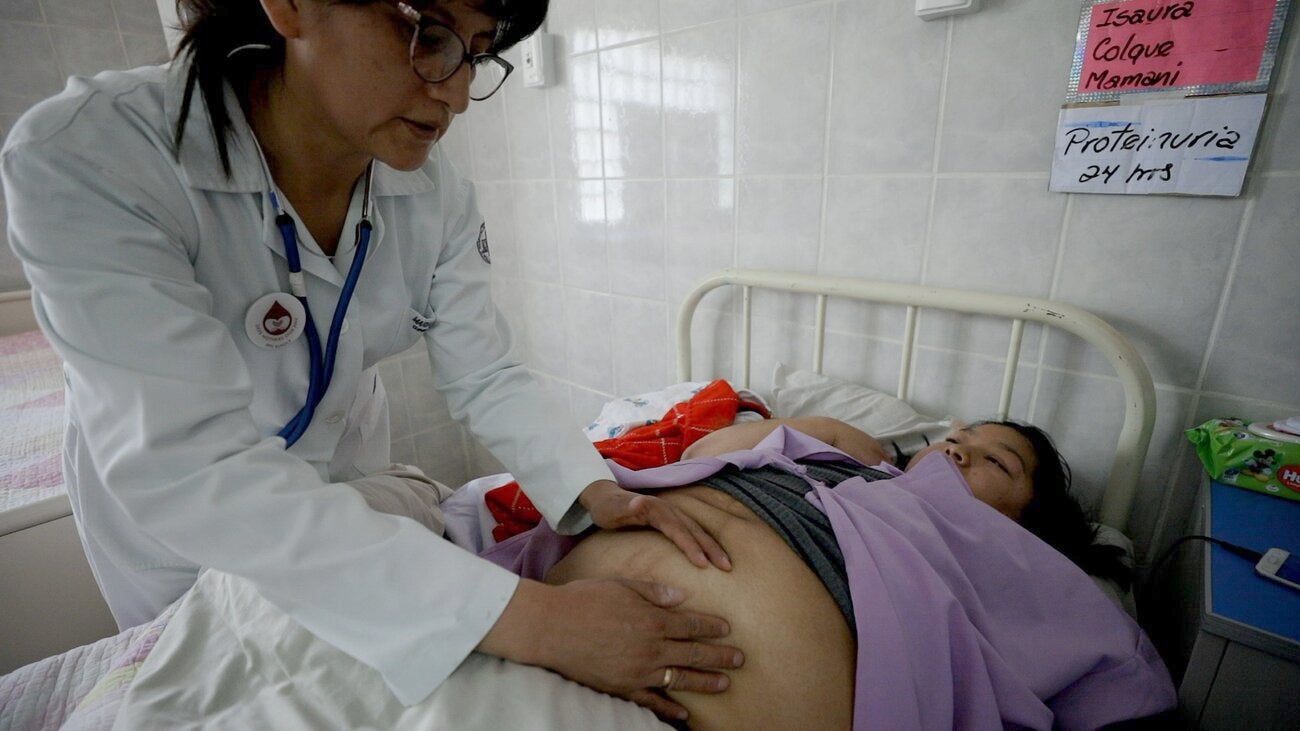 Doctor examining pregnant patient