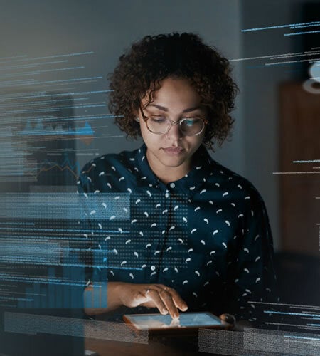 Professional young woman focused on using a tabet