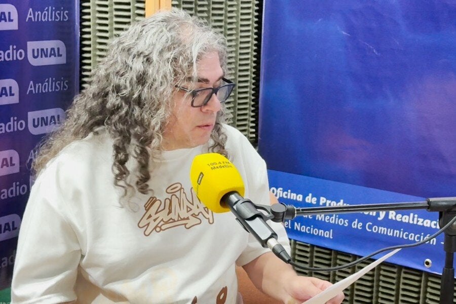 manuel speaking into a microphone