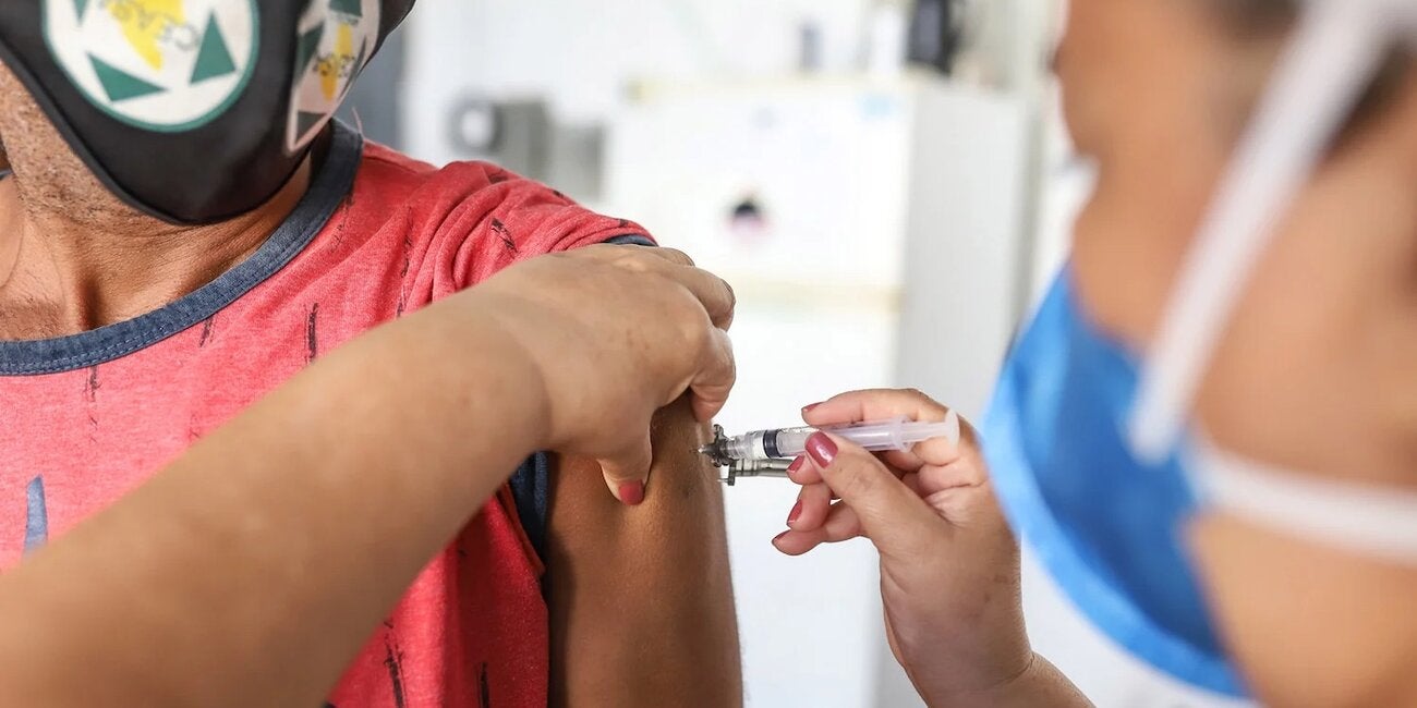 Person receiving COVID-19 vaccine