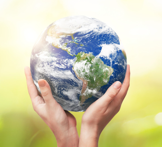 hands holding the planet