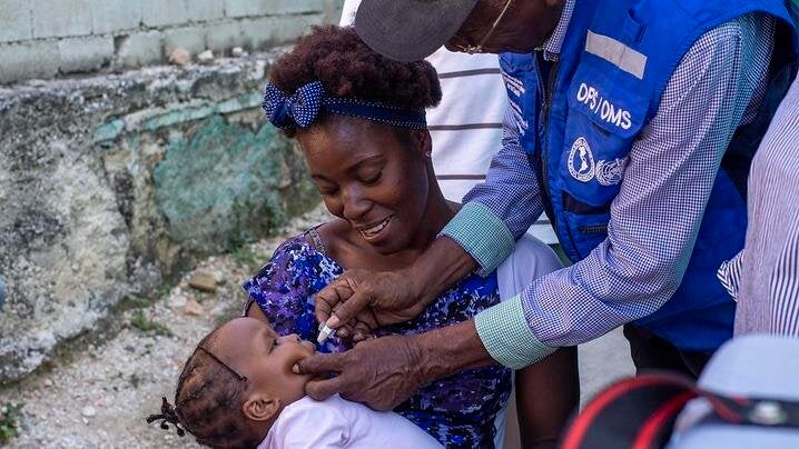 baby recieves oral vaccine