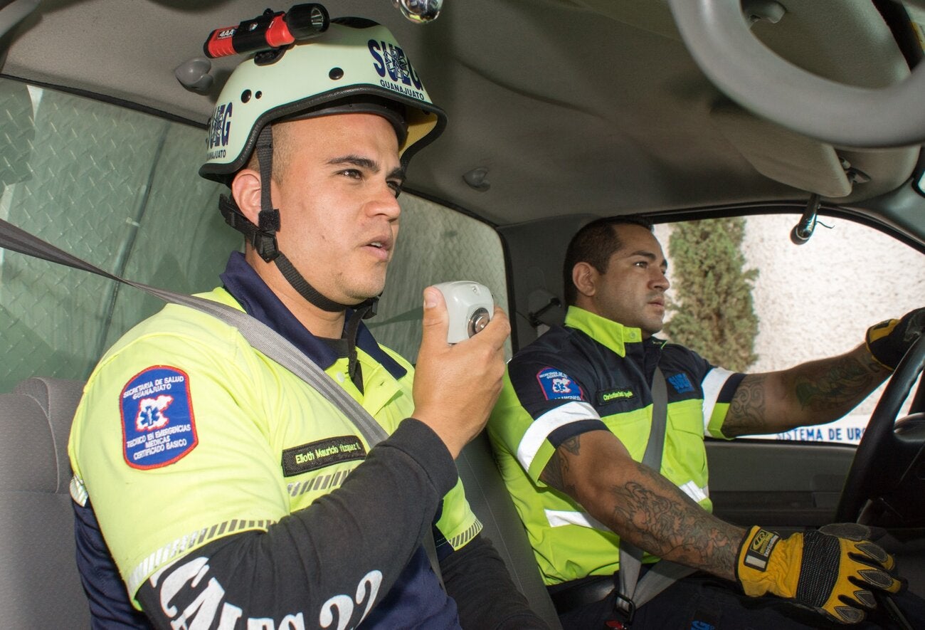 Two first responders in the interior of an ambulance