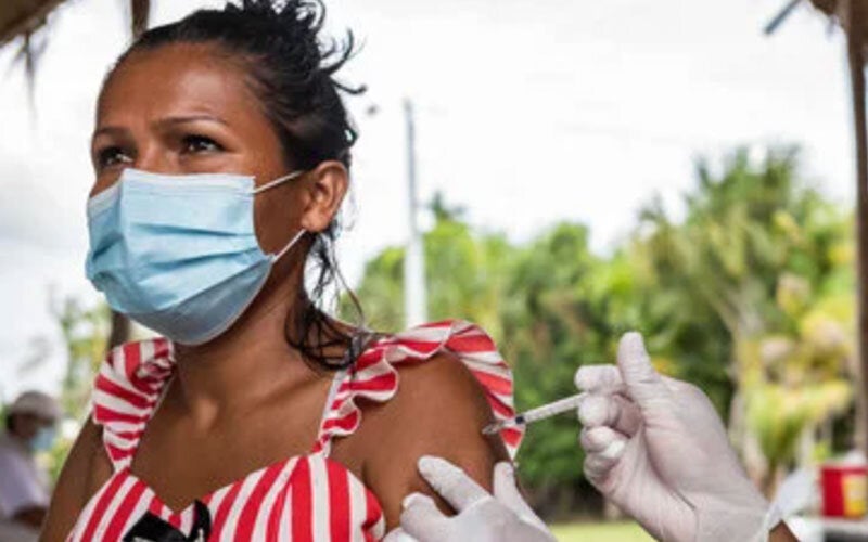 PAHO Immunization woman vaccine