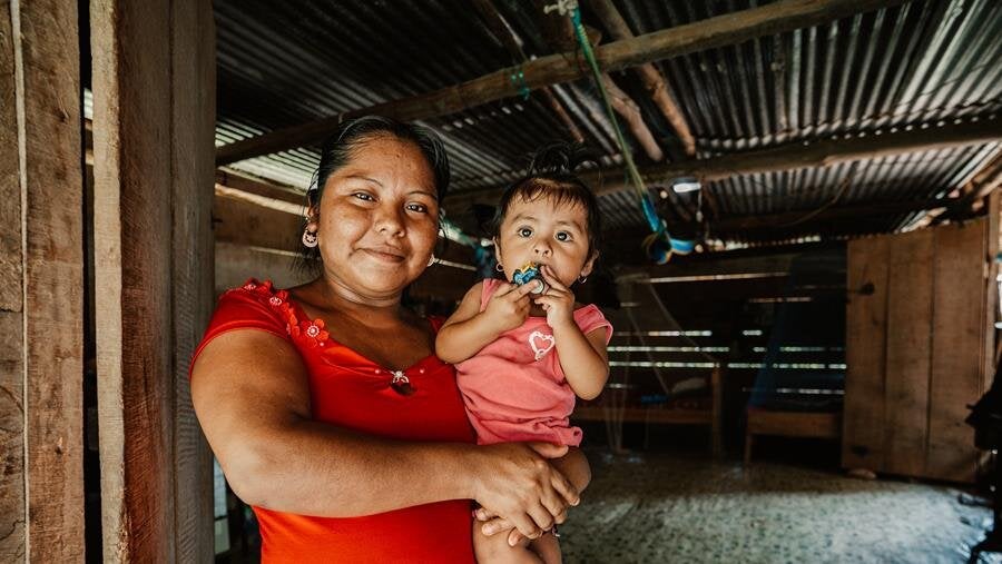 woman holding toddler