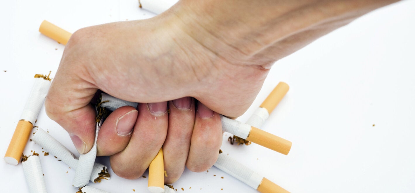 fist crushing cigarettes