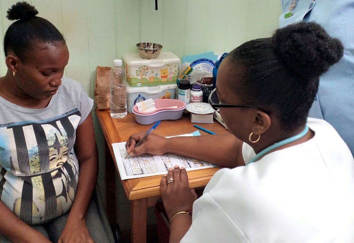 Pregnant woman receiving prenatal care