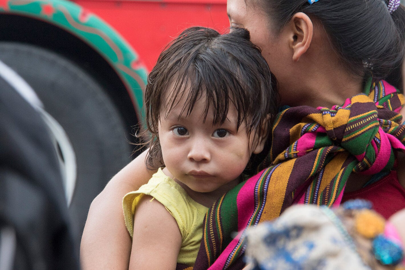 woman carrying child