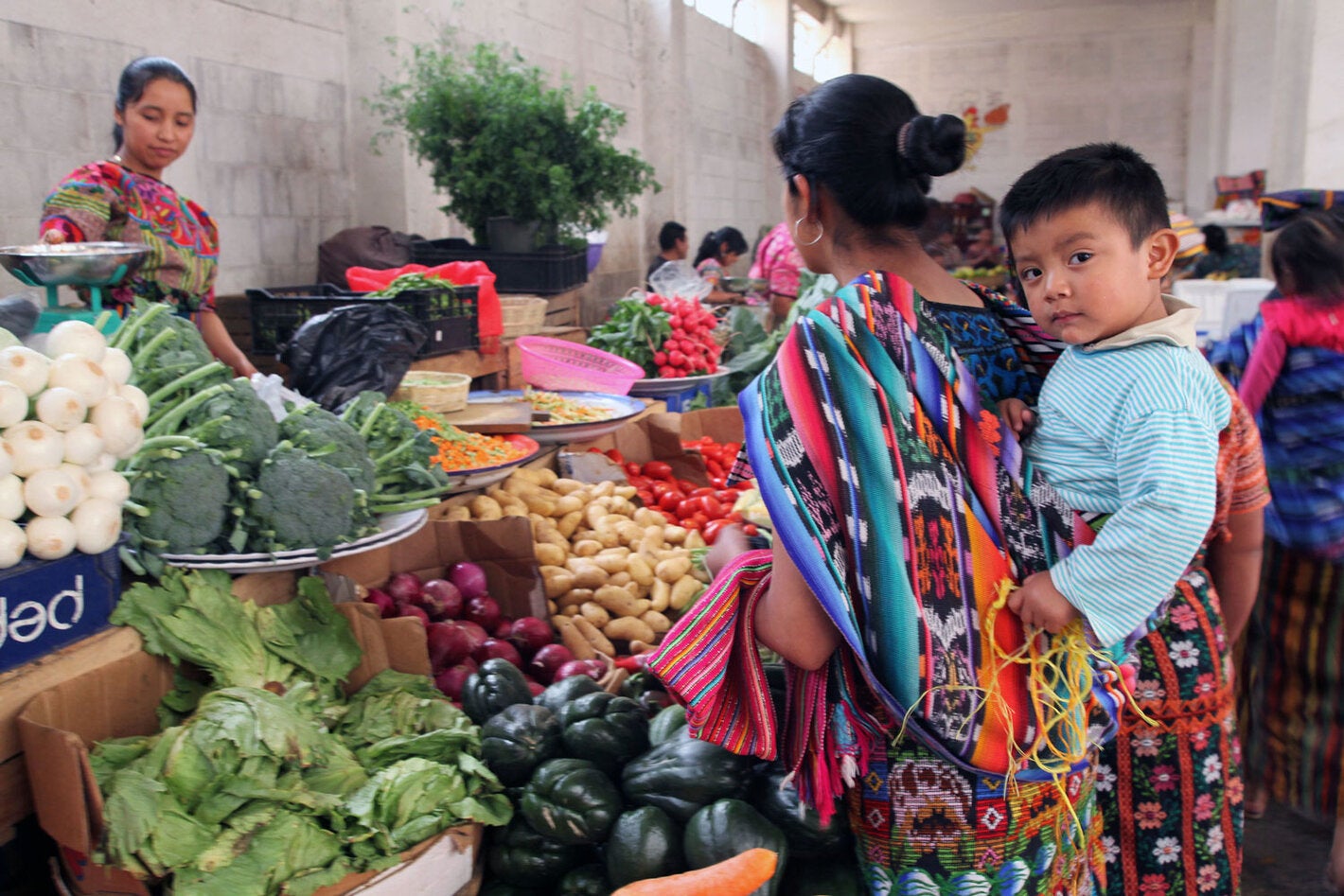 Indigenous moher and child in market
